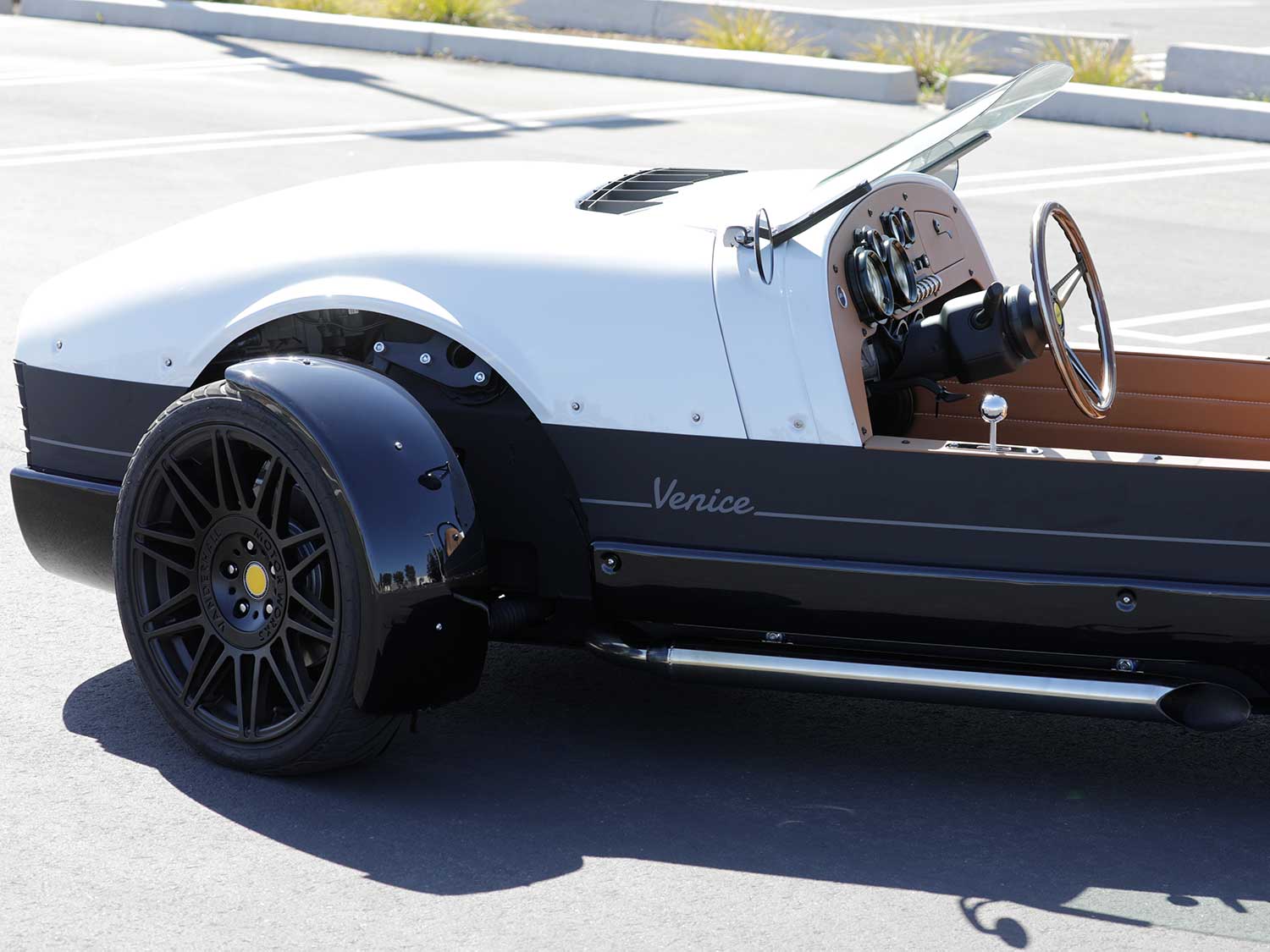 Spent fuel is expelled from a pair of 3-inch slash-cut exhaust pipes. The exhaust note offers a pleasing growl at any rpm.