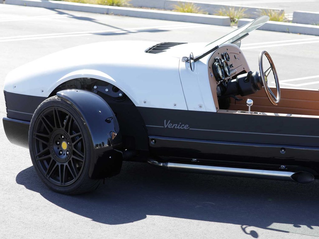 Spent fuel is expelled from a pair of 3-inch slash-cut exhaust pipes. The exhaust note offers a pleasing growl at any rpm.