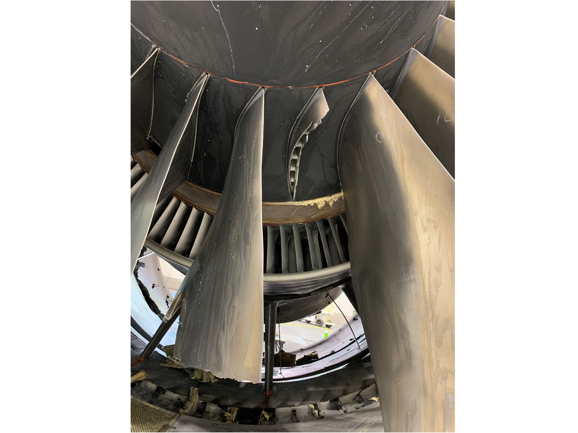 Two broken fan blades inside the jet engine on a Boeing 777-200.