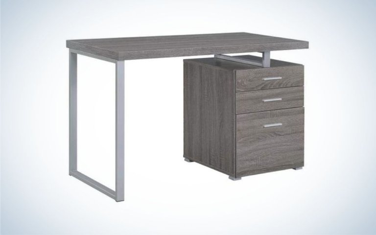 Grey file cabinet with three drawers and table