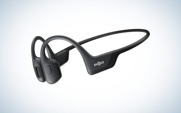 The Shokz OpenRun Pro bone-conduction headphones are placed against a white background with a gray gradient.