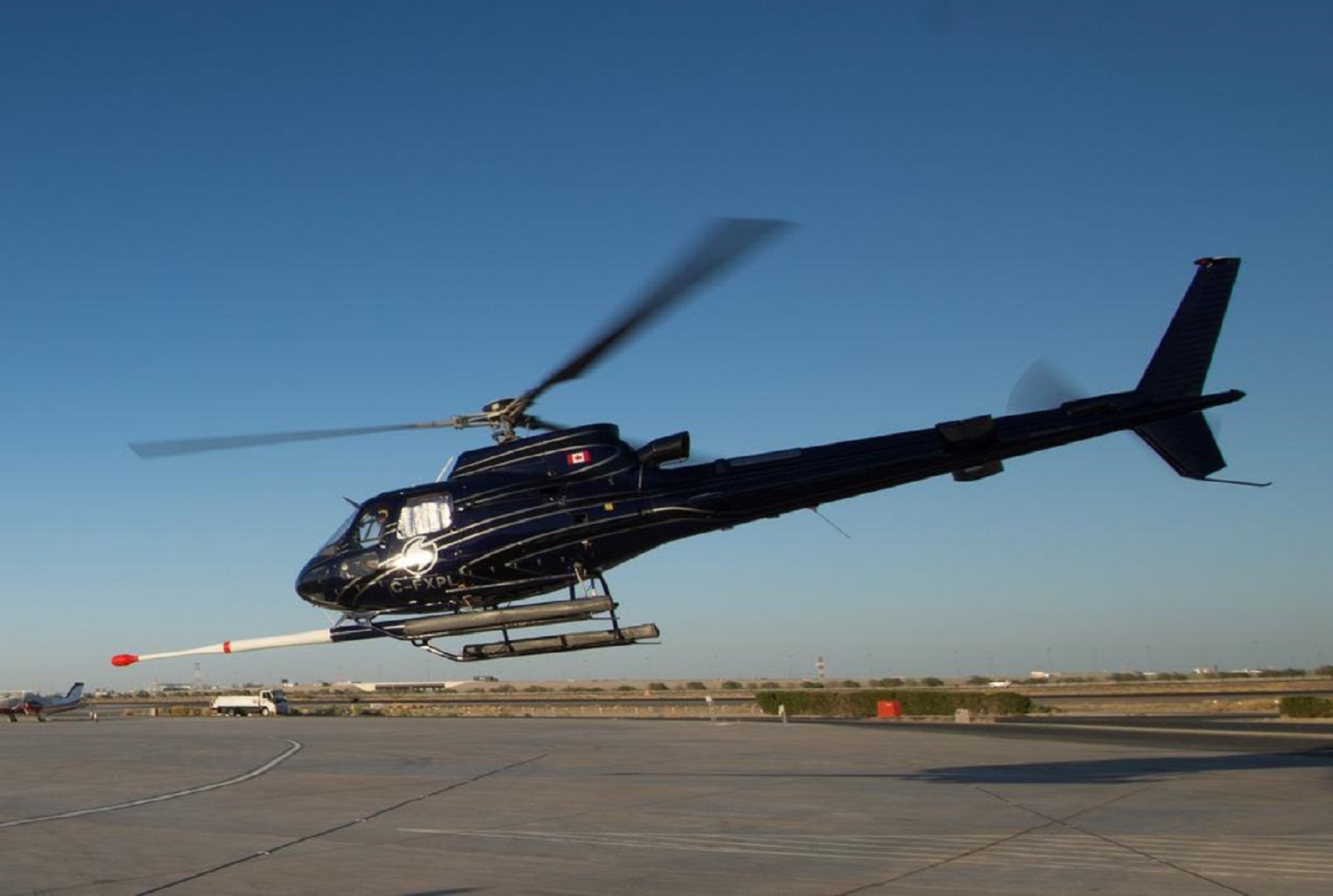 Earth MRI black helicopter with magnetic sensor on an airfield
