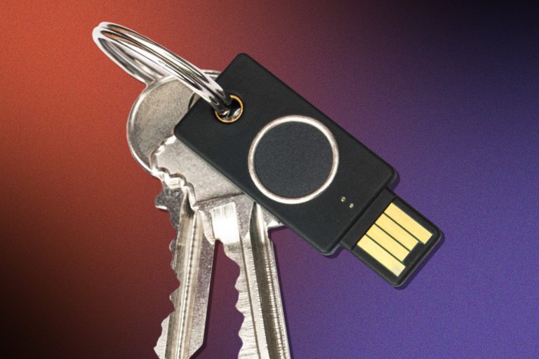 Yukibey Bio Series - FIDO Edition attached to a keychain on a black, red, and purple background