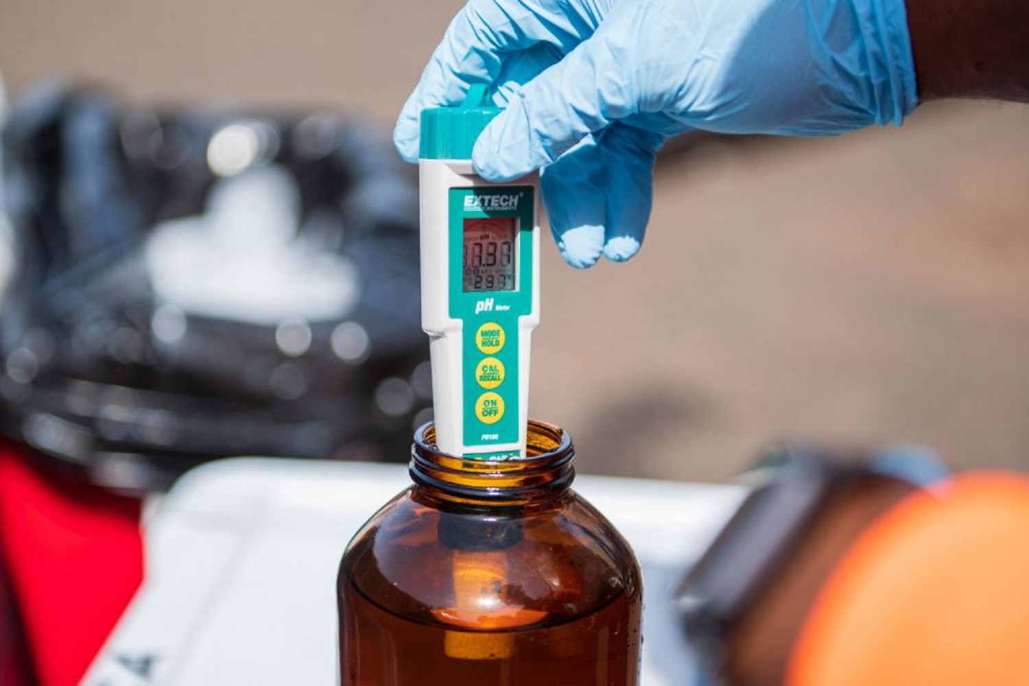 Navy using a blue pH meter to test Red Hill water on Oahu