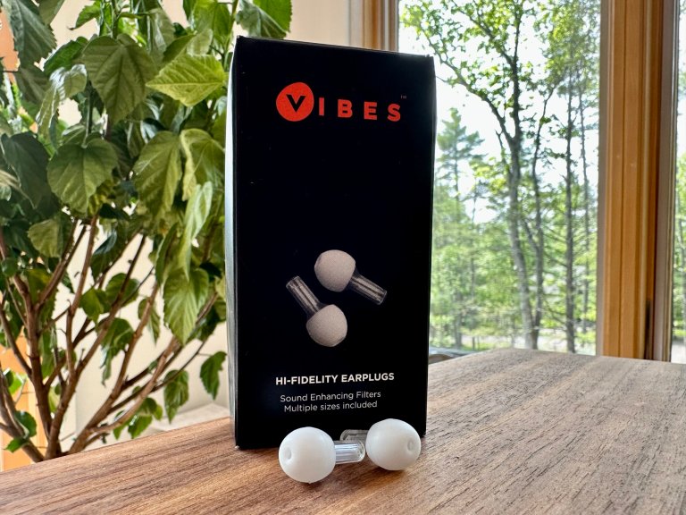 Vibes earplugs in front of a plant