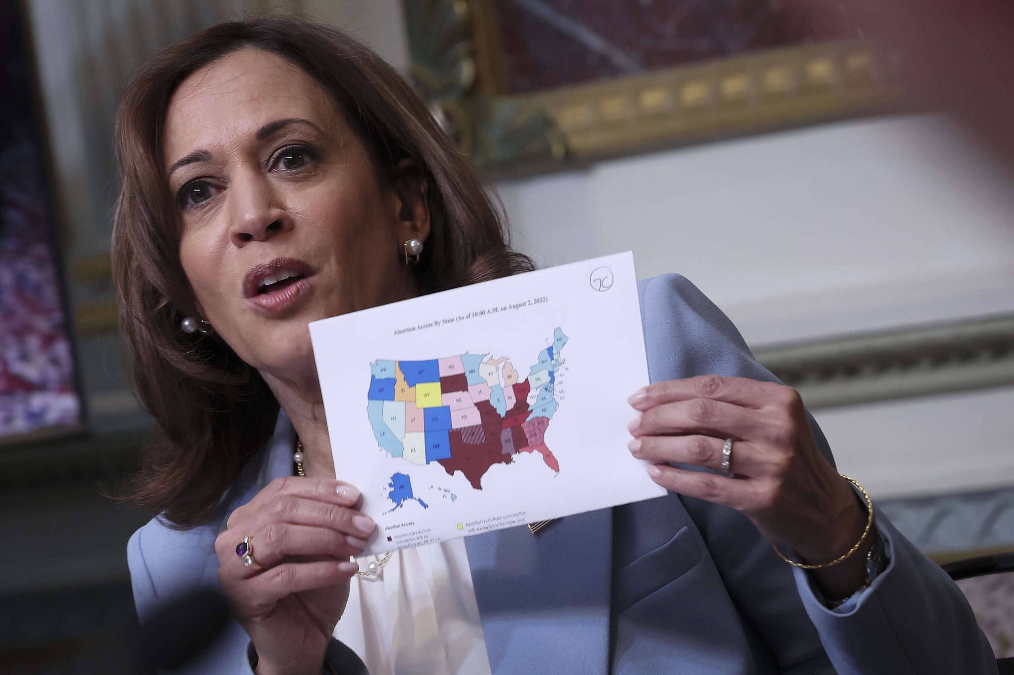 US Vice President Kamala Harris holds up a map of state abortion bans post-Roe v. Wade
