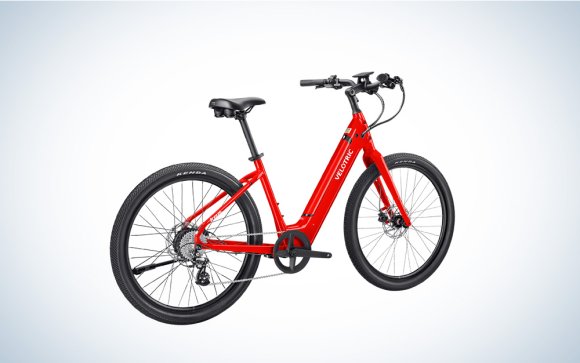 Scarlet Red-colored Velotric Breeze 1 Cruiser eBike on a grey gradient