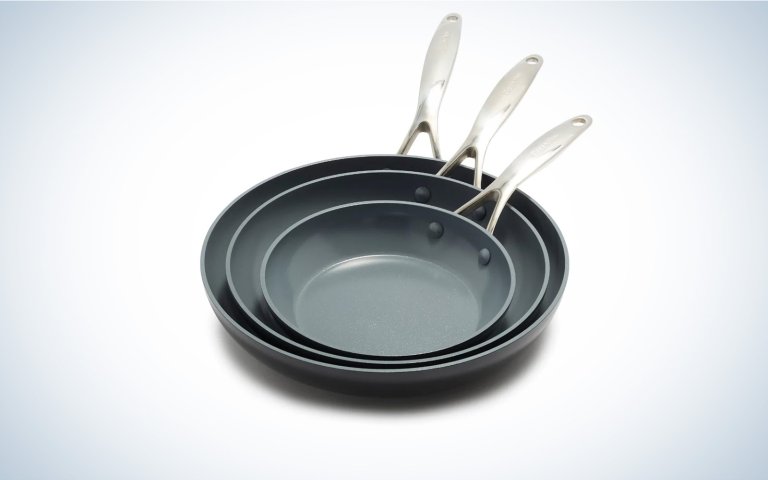 Green pan induction frying pans on a plain background.