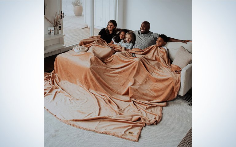People sitting with a Big Blanket Co. blanket