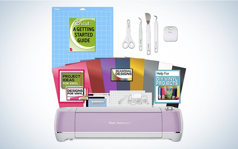 A purple Cricut Explore Air 2 on a blue and white background