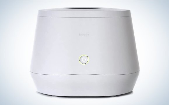 A white Lomi composter on a blue and white background