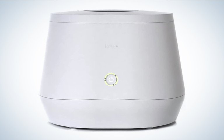 A white Lomi composter on a blue and white background
