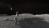 An illustration of two NASA astronauts in a lunar crater.