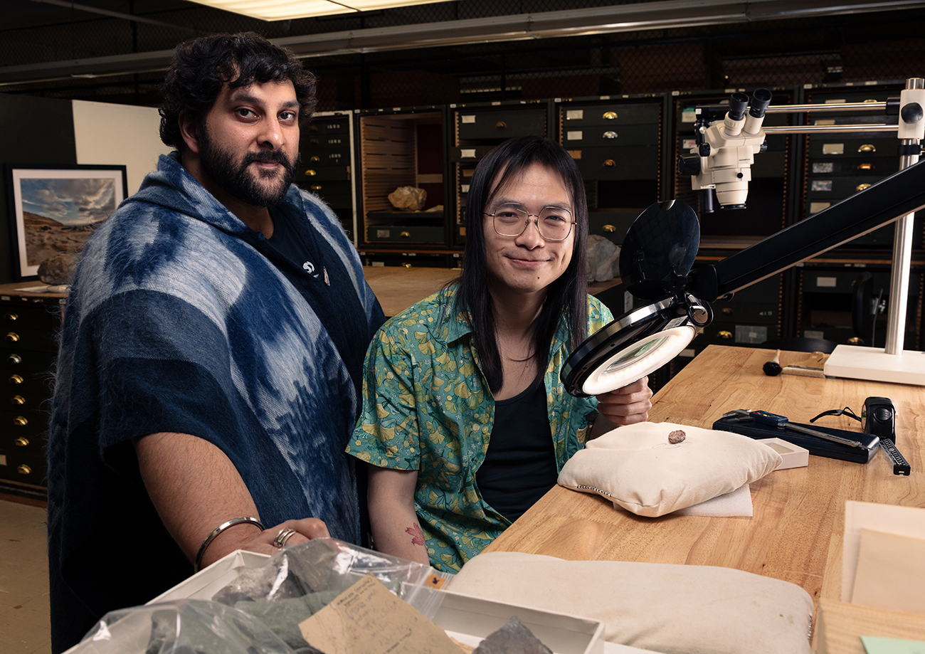 Calvin So (right), a doctoral student at George Washington University, and Arjan Mann (left), a Smithsonian postdoctoral paleontologist and former Peter Buck Fellow, with the fossil skull of Kermitops in the Smithsonian’s National Museum of Natural History fossil collection. CREDIT: Brittany M. Hance/Smithsonian.