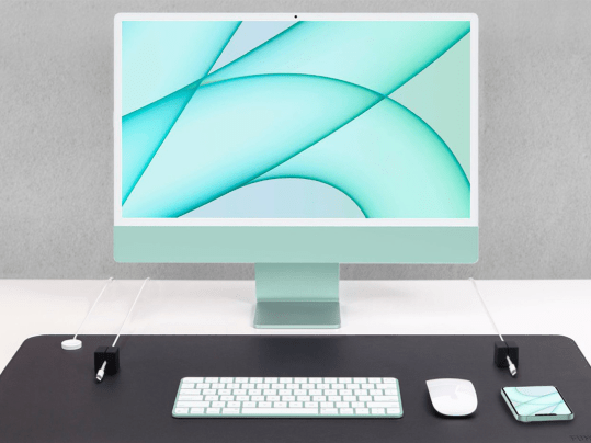 A blue desktop computer on a desk