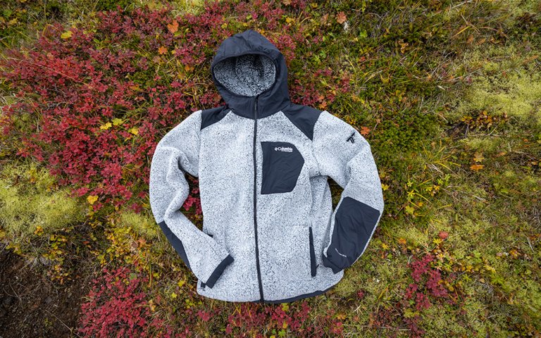 Grey and black Columbia Sportswear Arctic Crest Sherpa Fleeces on green and red lichen in Iceland