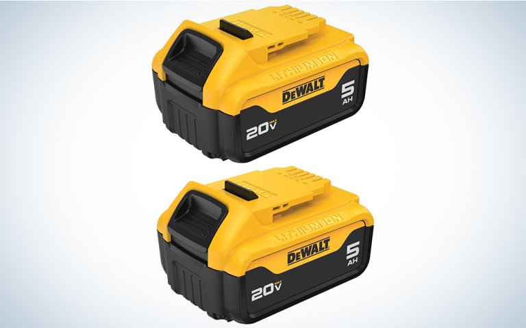 A pair of DeWalt power tool batteries on a plain background