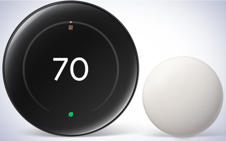Nest Learning Thermostat on a plain white background.