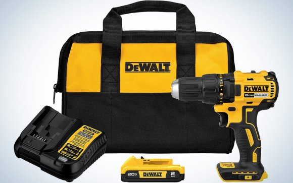 A DeWalt Drill Driver kit with a bag and charger on a plain background