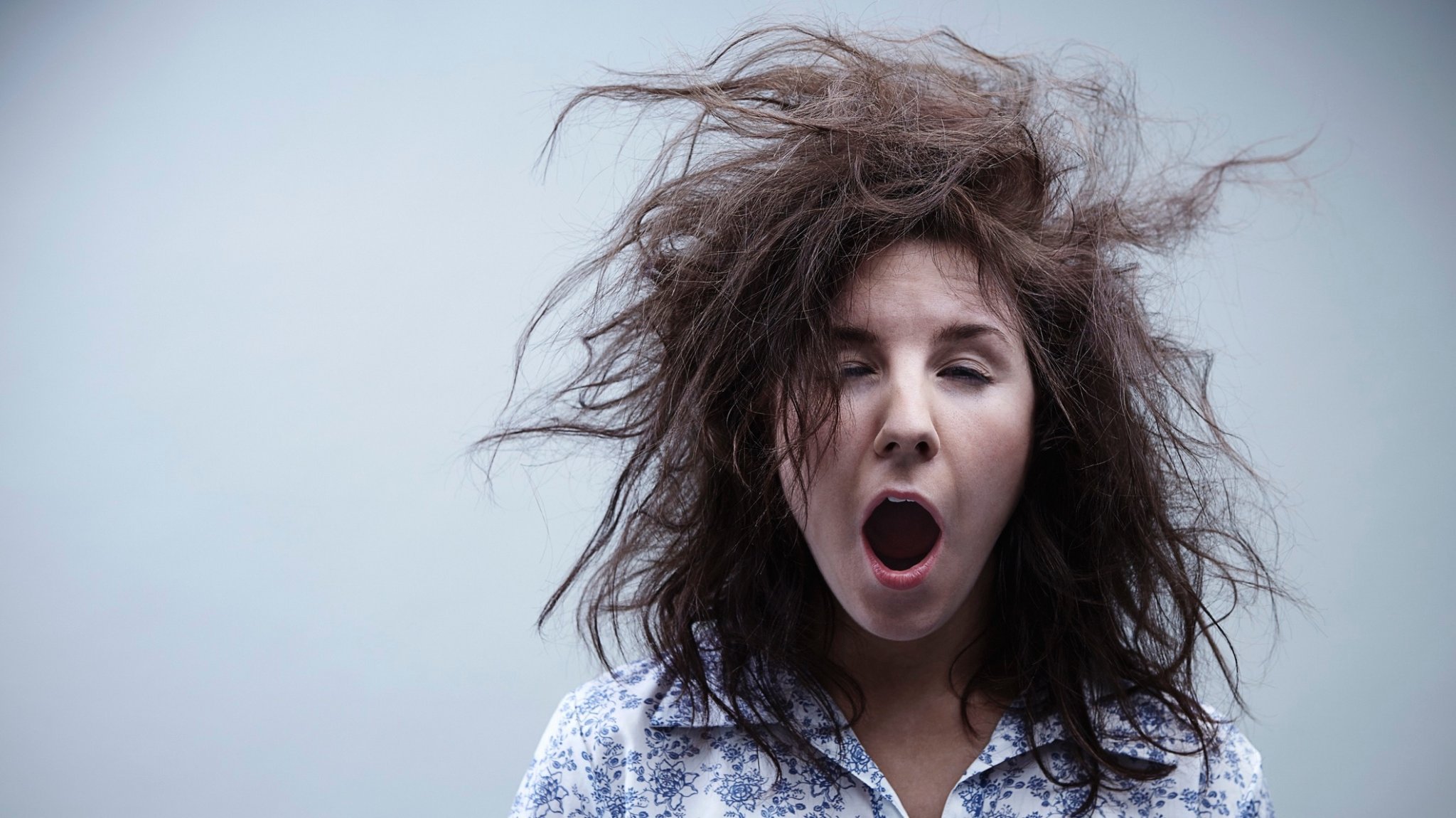 Young woman yawning, close up