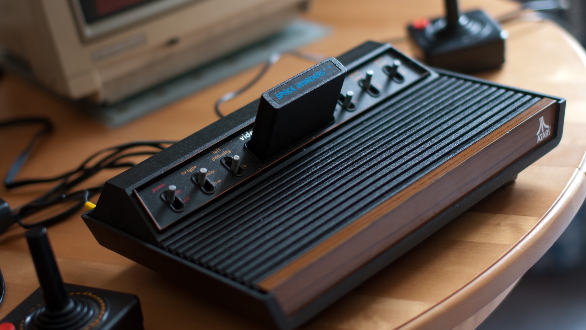 This is the wonderful six switch version of the Atari 2600 VCS in all it's glory. Check that fake wood effect, those beaufiful black grooves. Those RSI inducing joysticks. They don't make them like that anymore. You plugged in the cartridge, and switched it on. None of this loading nonsense.