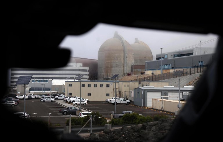SAN LUIS OBISPO, CA - AUGUST 9, 2024 - Twin containment domes rise above the facility as seen through a windshield on the drive to the Diablo Canyon Nuclear Power Plant in San Luis Obispo on August 9, 2024. (Genaro Molina/Los Angeles Times)