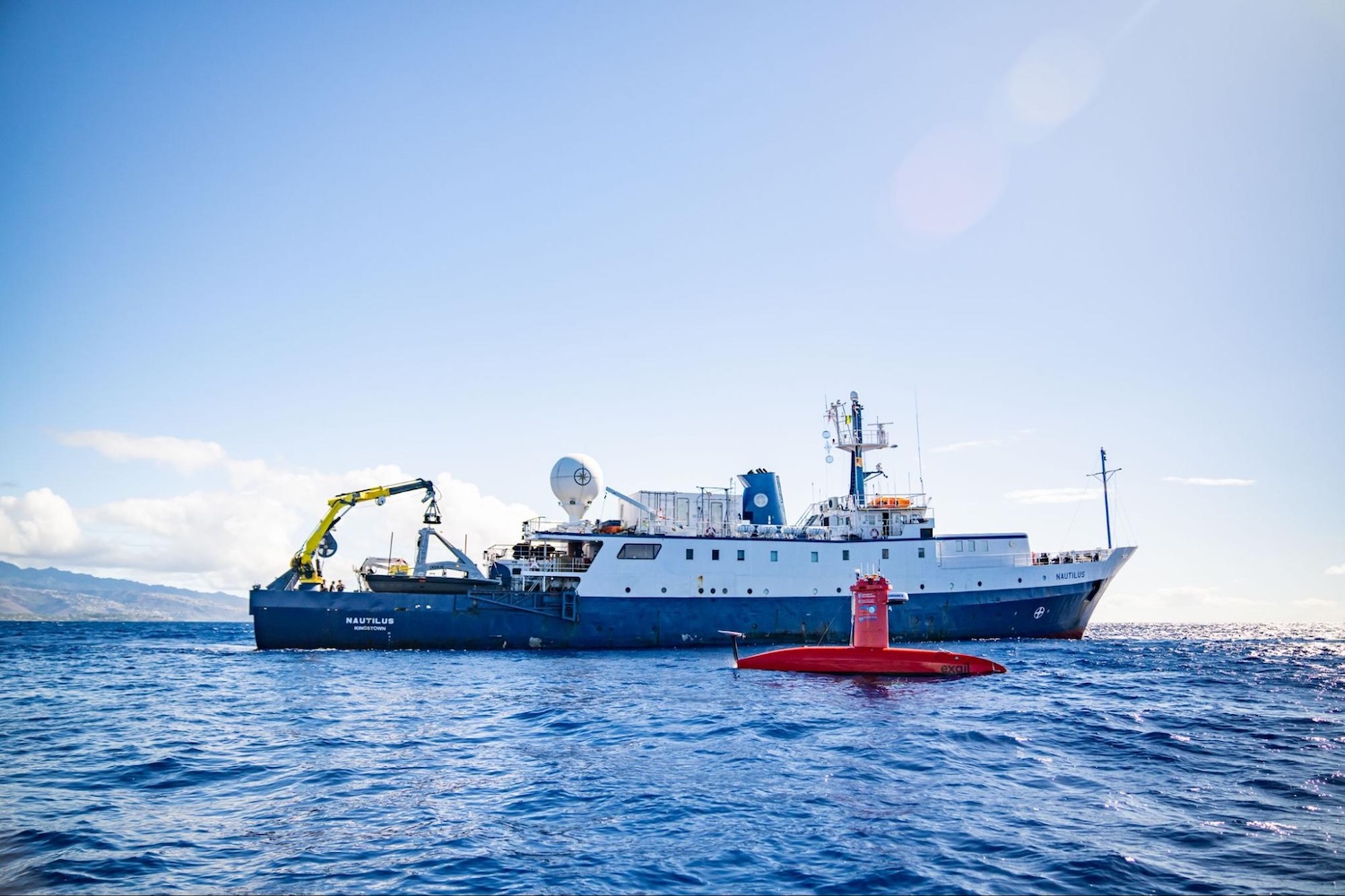 Nautilus research vessel at sea with DriX submersible