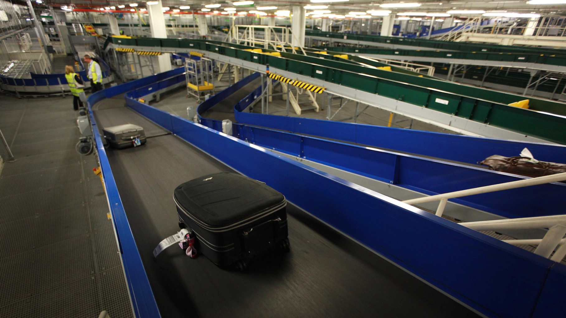 What happens to your bag after you check it in at the airport?