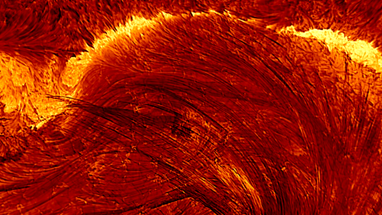 a solar flare as seen with a solar telescope. yellow streaks represent energy hurled away from the sun