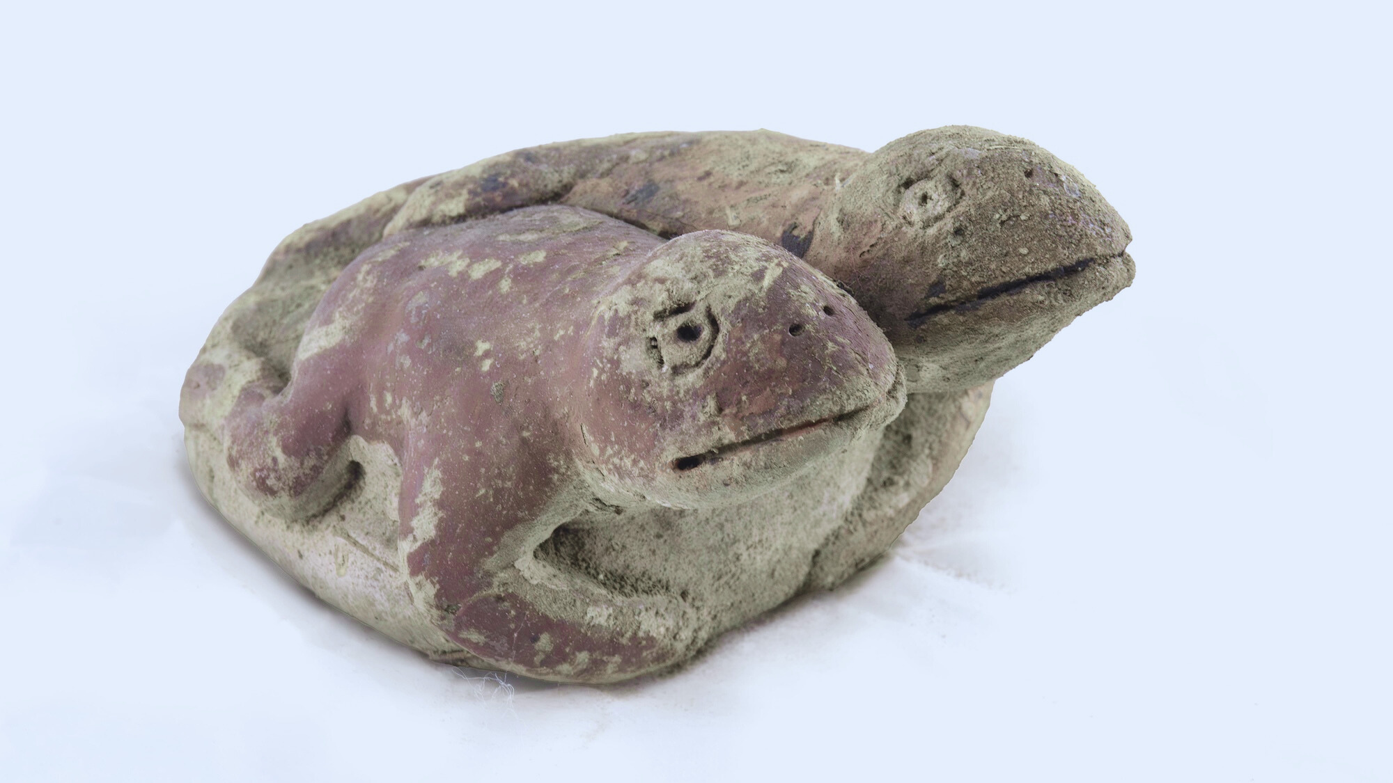 Clay sculpture of two frogs from Caral civilization