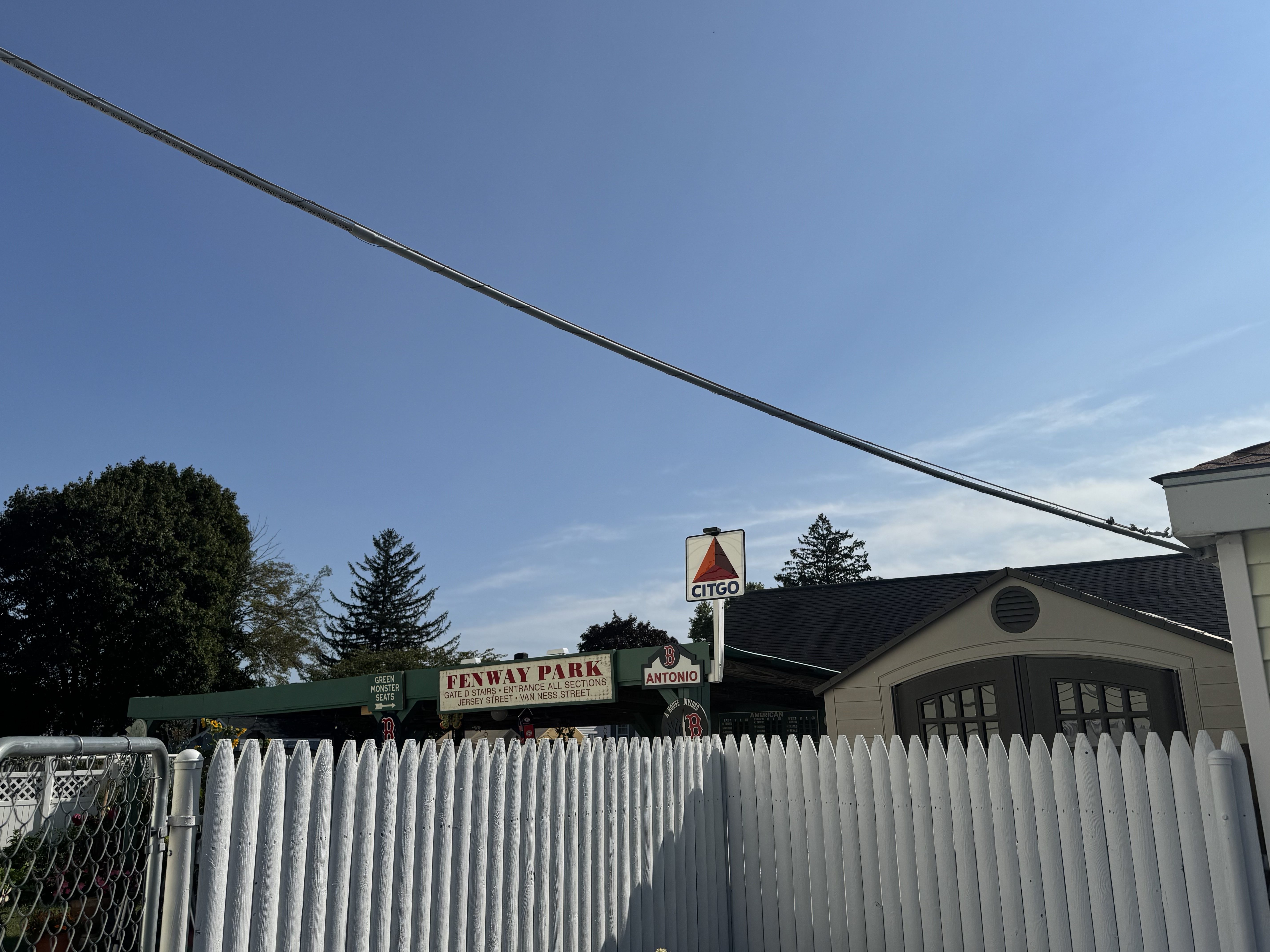a replica of fenway park built in a backyard with a sign for citgo with a red triangle