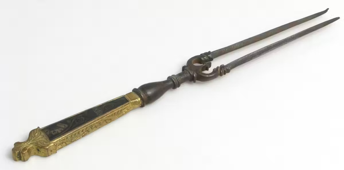 old fork with gold handle