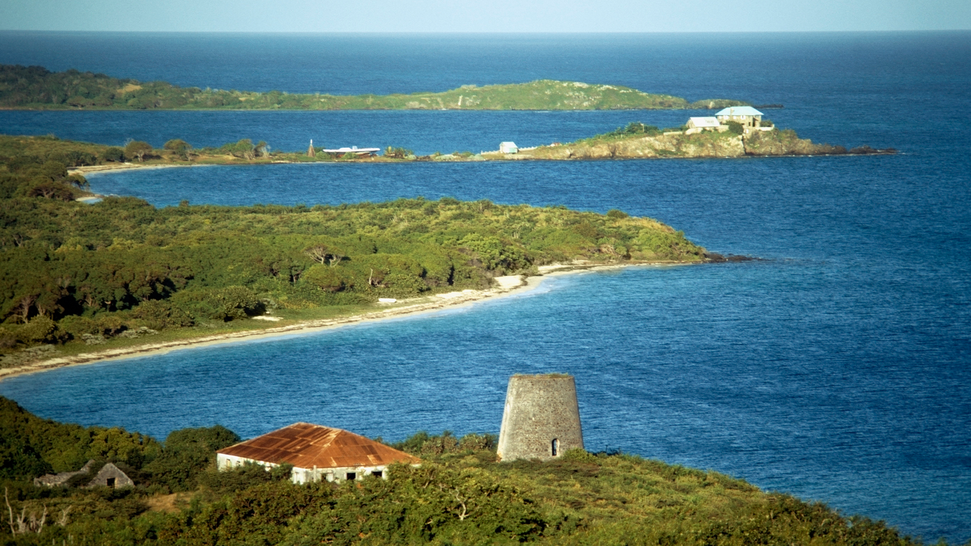 an aerial view of an island with stone structures