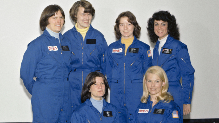 The first six women in newly issued, incompletely adorned astronaut jumpsuits, 1978: (front, left to right) Sally Ride, Rhea Seddon; (rear) Kathy Sullivan, Shannon Lucid, Anna Fisher, Judy Resnik.