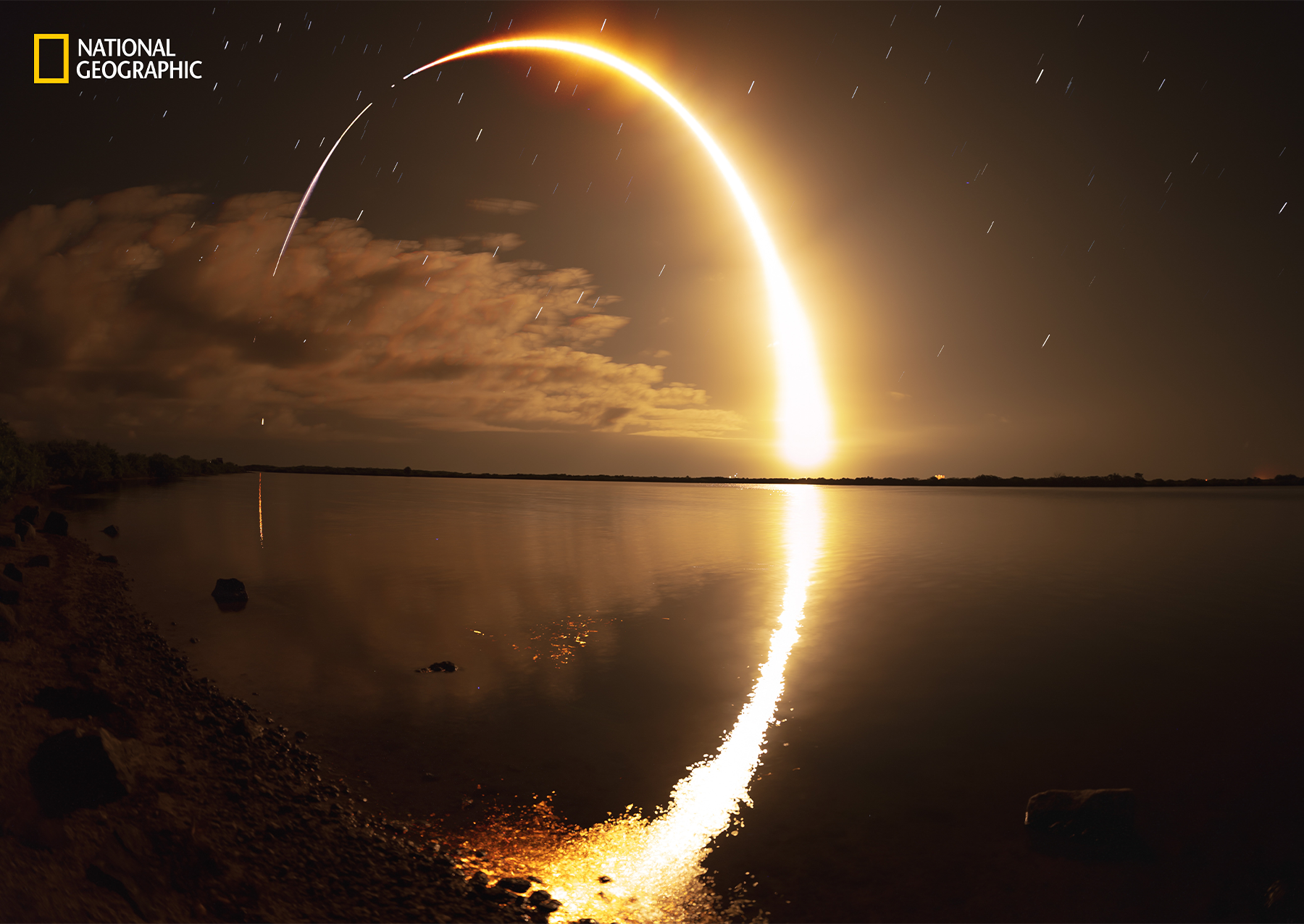 Atoms and molecules in Earth's upper atmosphere, excited by sunlight, from a faint red haze high above Florida. Pettit spent nearly 600 days in space and often launched from Cape Canaveral. On a dark, star-studded night, Tafreshi observed a similar launch—this time of cargo via SpaceX's Falcon 9 rocket— from Merritt Island National Wildlife Refuge. 