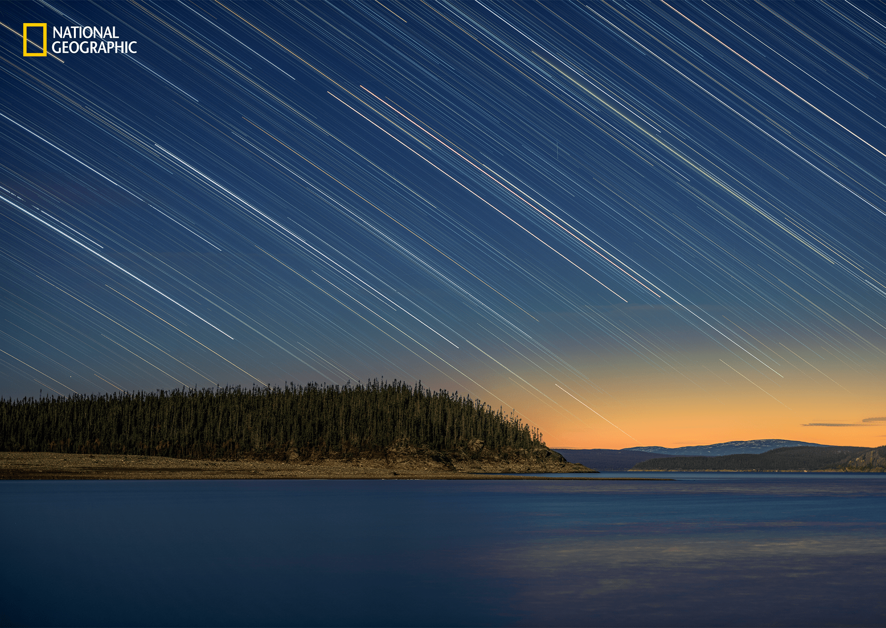 Over 214 million years ago, an asteroid slammed into Canada and created the Eye of Quebec, a 62-mile-wide crater clearly visible from Pettit's vantage point aboard the ISS. In the years since, that cater has filled with water, forming the Manicouagan Reservoir. At dusk one evening along the reservoir bank, Tafreshi turned his camera toward the cosmos, highlighting sinewy streaks of Starlight. 