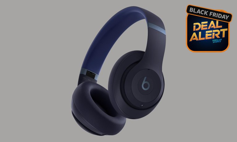 Navy Beats Studio Pro headphones on a grey Amazon Black Friday background