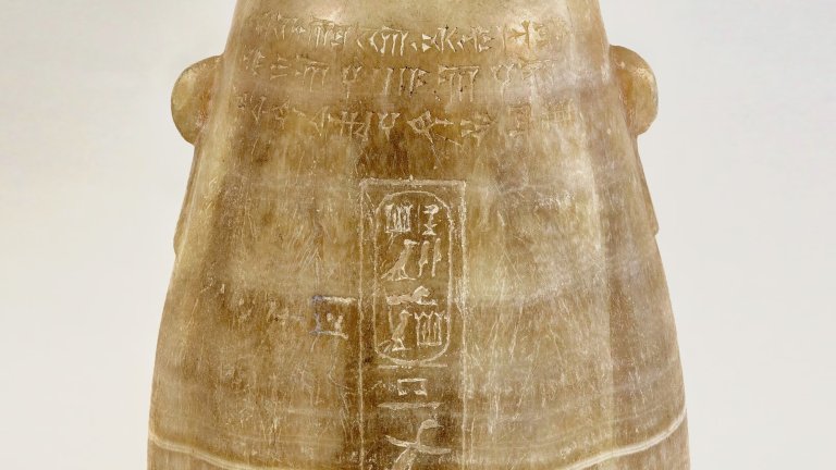 Close up of Egyptian ceramic vessel with inscriptions