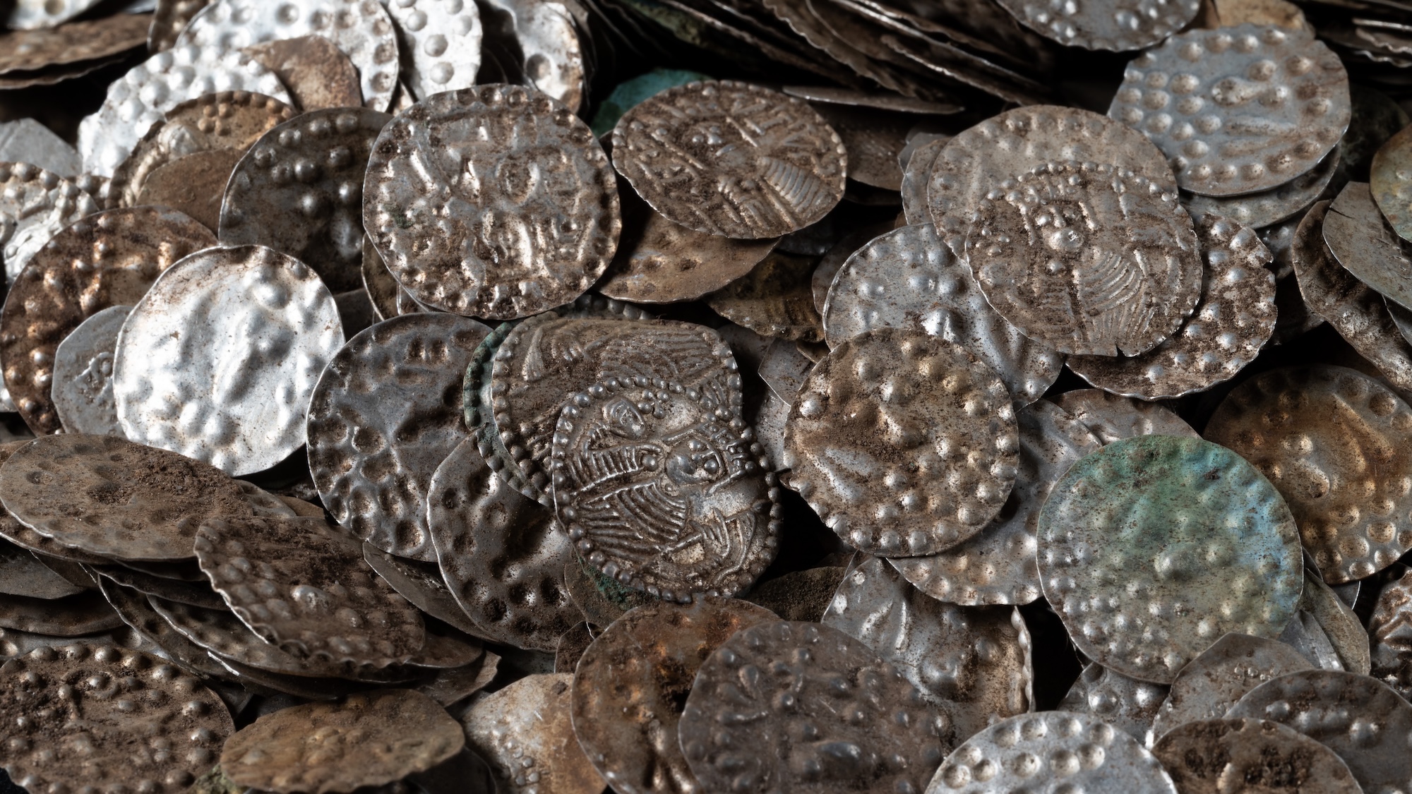 Swedish silver medieval coins in a pile