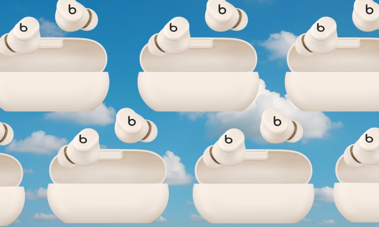 Beats Solo Buds arranged in a pattern against a cloudy sky