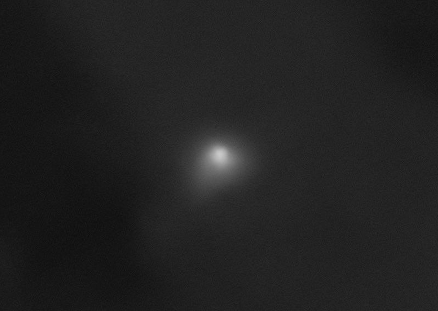 a black and white image of a comet