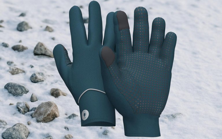 Smartwool gloves on a snowy background on sale at REI