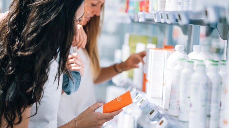 Two women stocking up on sunscreen with their remaining 2025 FSA funds
