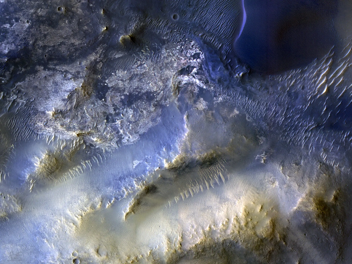 Aerial view of Syrtis Major region of Mars showing dunes, craters, and plateaus