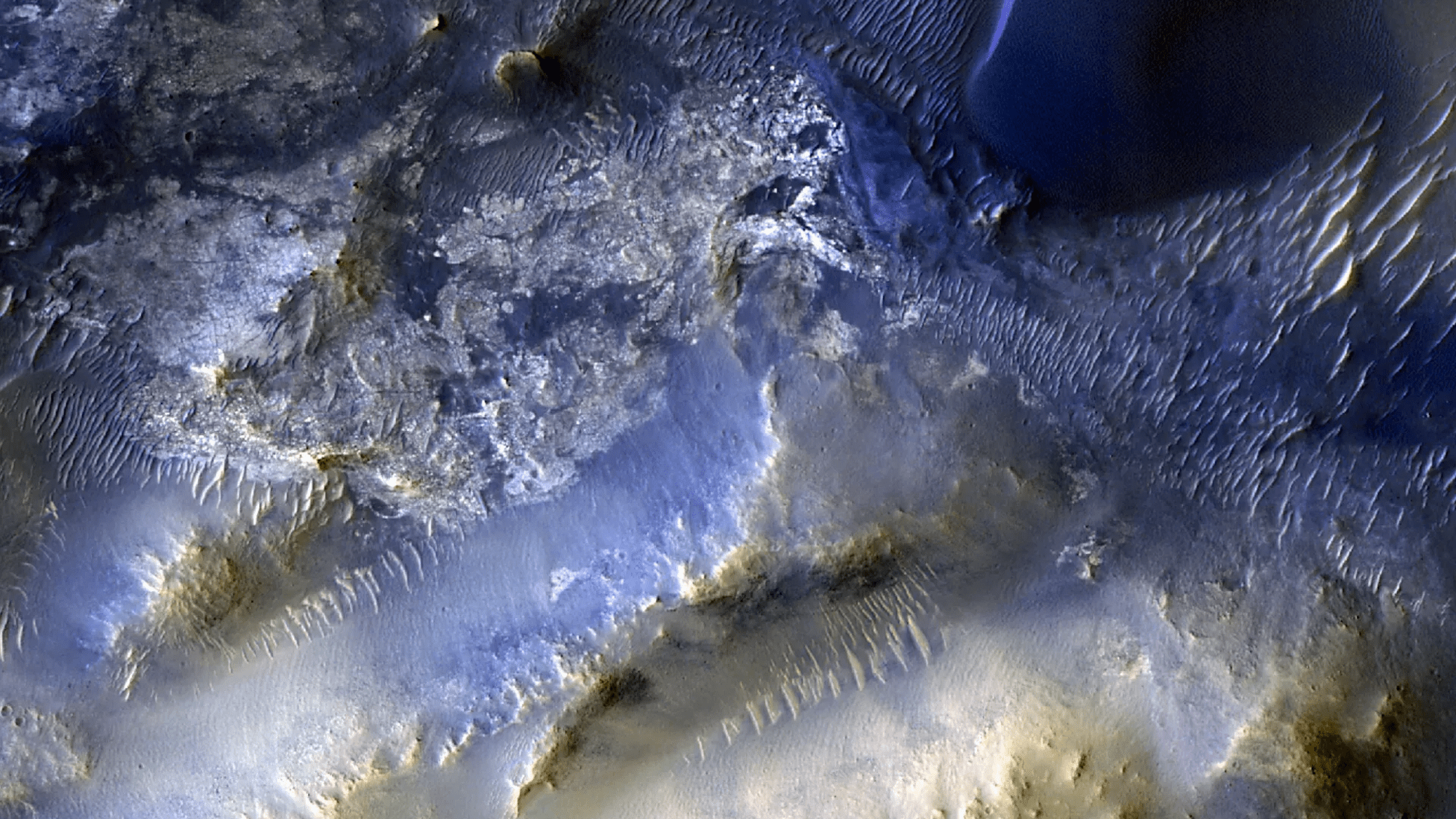 This view of a region called Syrtis Major is from the 100,000th image captured by NASA’s Mars Reconnaissance Orbiter using its HiRISE camera. Over nearly 20 years, HiRISE has helped scientists understand how the Red Planet’s surface is constantly changing.