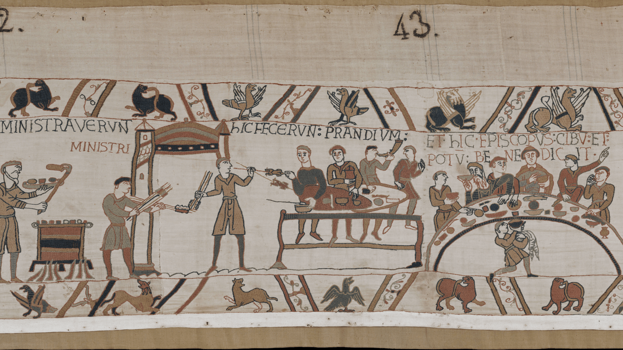 A scene from the Bayeux Tapestry showing a medieval dining scene involving Bishop Odo of Bayeux.
