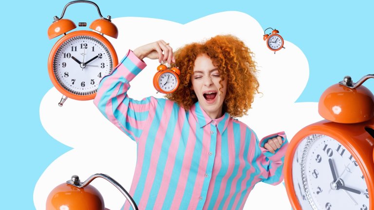 Woman in pyjamas stretching and yawning surrounded by alarm clocks.