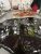 an orange and green blob of liquified candy on a steel table