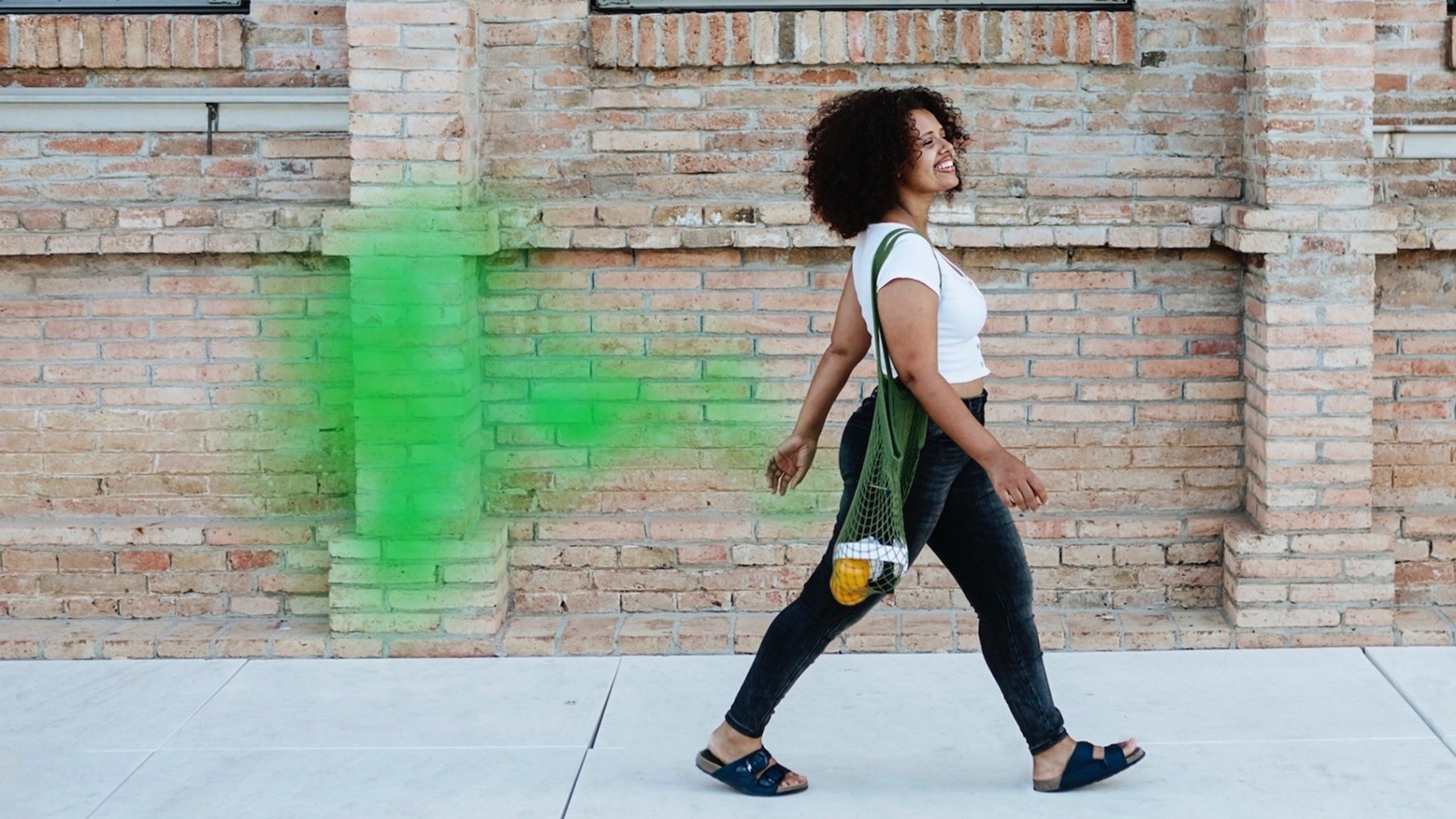woman walking with green fart cloud
