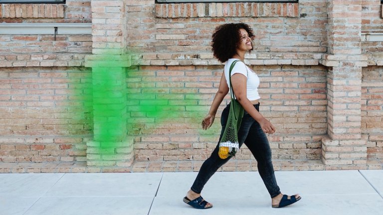 woman walking with green fart cloud